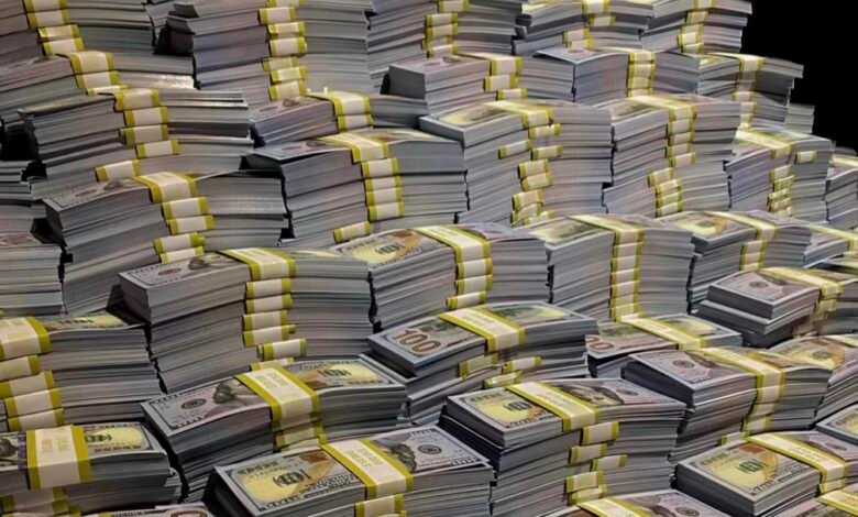 المؤشر الاقتصادي : حزم من الدولار الأمريكي ترمز إلى استحقاقات الديون الخارجية