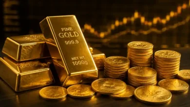 تجنب مخاطر الاستثمار في الذهب- سبائك ذهب وعملات ذهبية مع خلفية رسوم بيانية مالية تعبر عن الاستثمار في الذهب وتجنب المخاطر